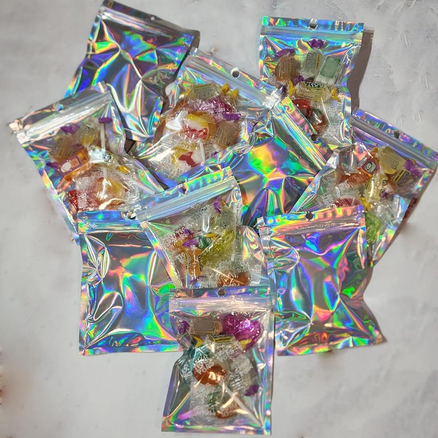 ZOENHOU 100 PCS 20 x 14cm Large Holographic Foil Bags, 7.8x5.5 Inch Resealable Mylar Zip Lock Bags, Holographic Packaging Bag Smell Proof Bags for Party Candy Cookie Favor Food Jewellery Storage - Image 5